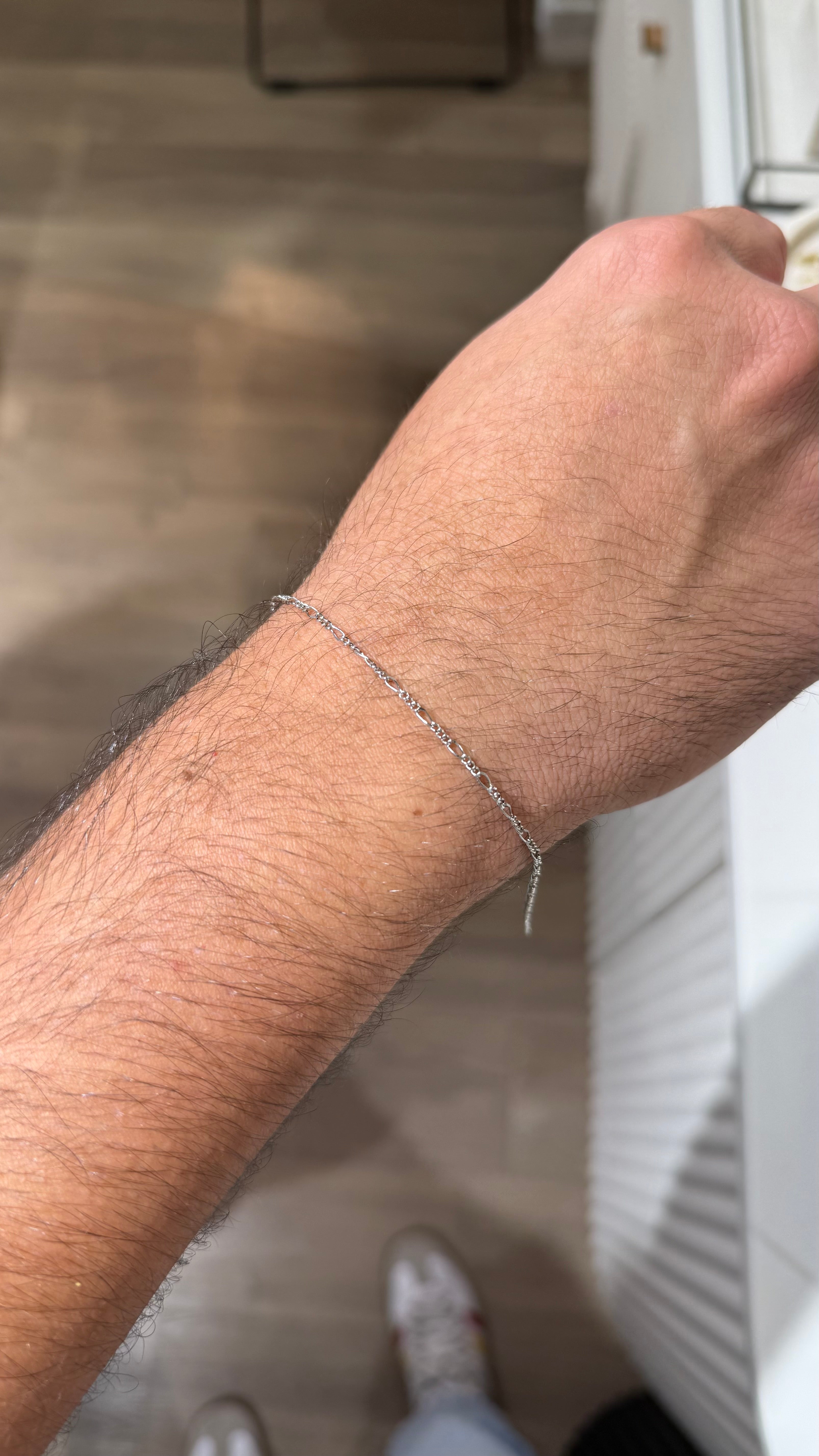 Pulsera fígaro plateada permanente