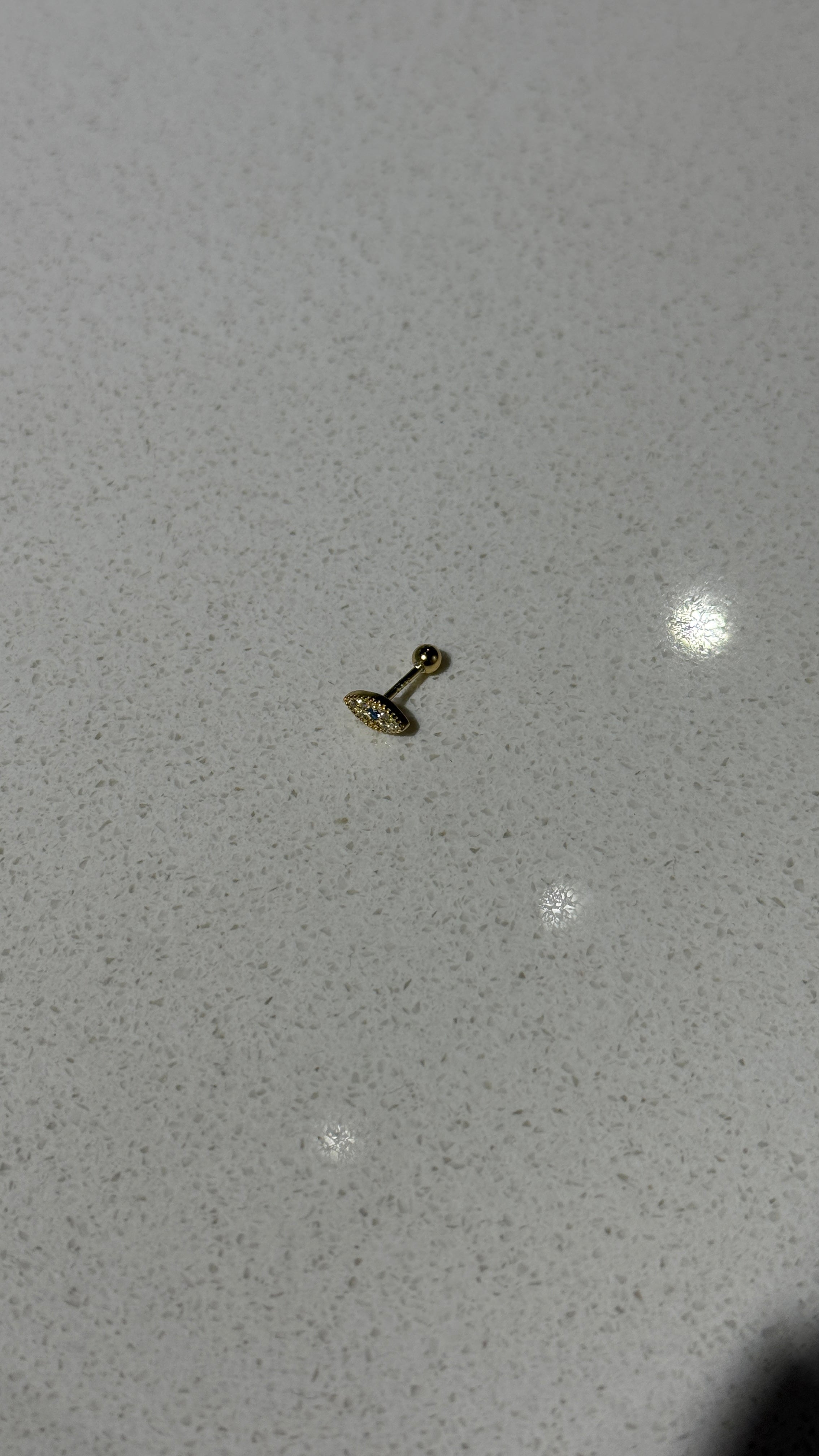 ojo piercing gold